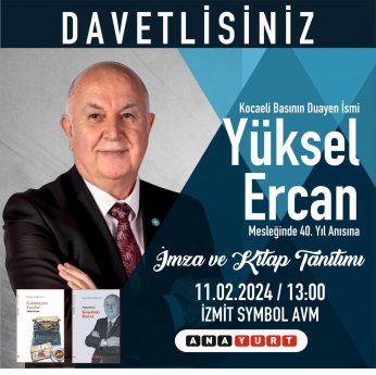 Yüksel Ercan kitaplarını imzalıyor